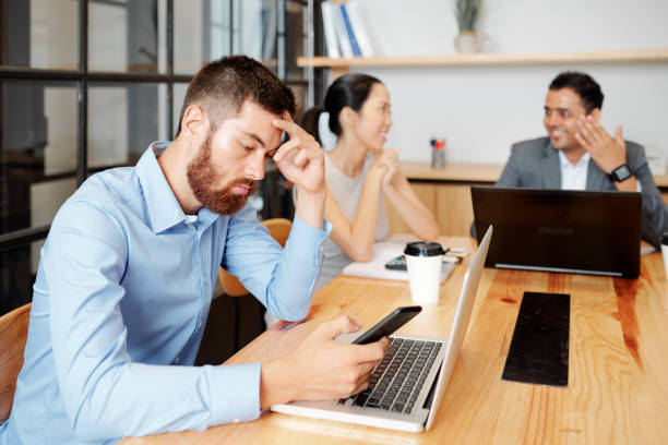 istock Bored businessman at meeting 1316007612
