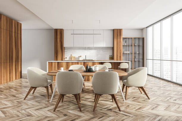 istock White wooden kitchen interior with eating table and chairs, city view 1316008656