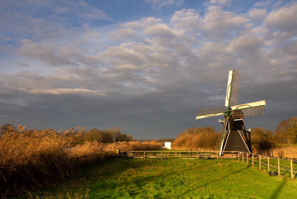 The Follega windmill near the Dutch village seen under a heavy clouded sky
