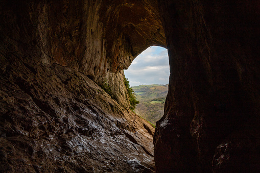 Climbing up in the mount on the morning in the Peak District, Thor Cave