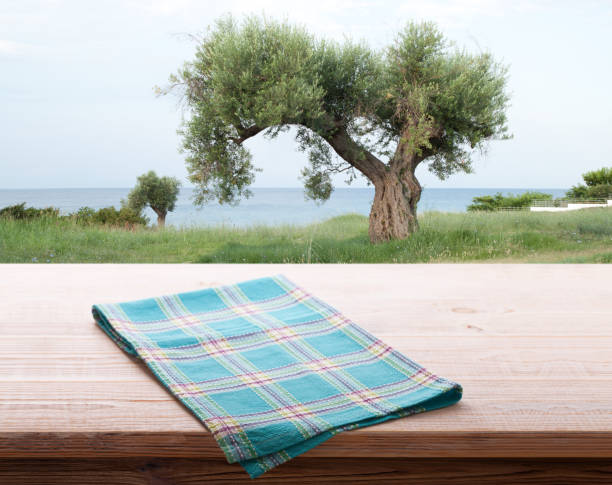 istock Empty napkin on wooden desk. Summer background. 1316011645