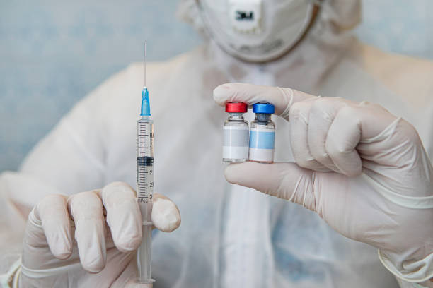 istock Blank label for your text and design on the bottle with the liquid. Scientific development of vaccines in the laboratory. Testing of vaccines. concept of laboratory research. 1316013229