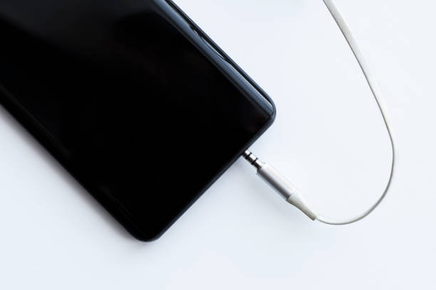 istock mobile smartphone audio cable jack 3.5mm and input hole on white background 1316013244
