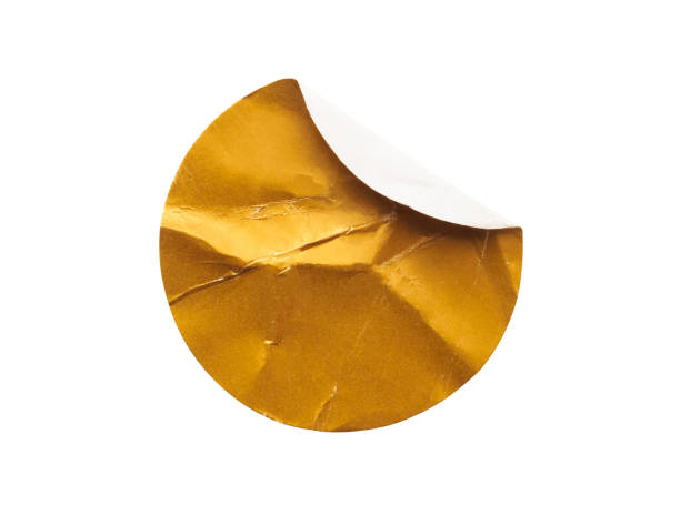 istock Blank golden round adhesive paper sticker label isolated on white background 1316013424