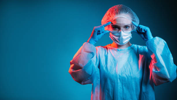 istock covid-19 protection doctor wearing goggles ppe 1316013507