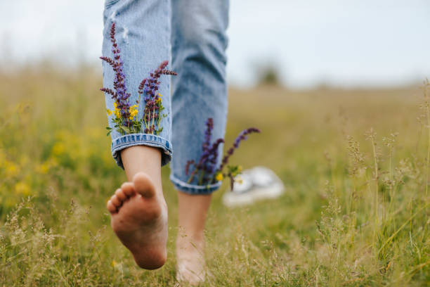 istock Enjoying the touch of fresh spring grass under your bare feet 1316015601