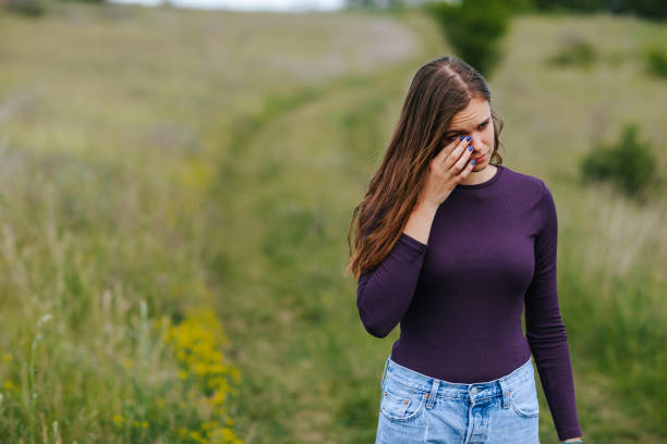 istock Allergic woman rubbing her eyes in nature 1316015663