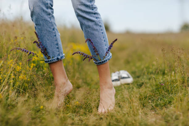 istock Enjoying the touch of fresh spring grass under bare feet 1316016150