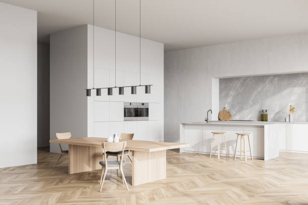 istock Modern contemporary design kitchen room interior. Dining table with chairs. Parquet flooring. White and wood material. 1316019060