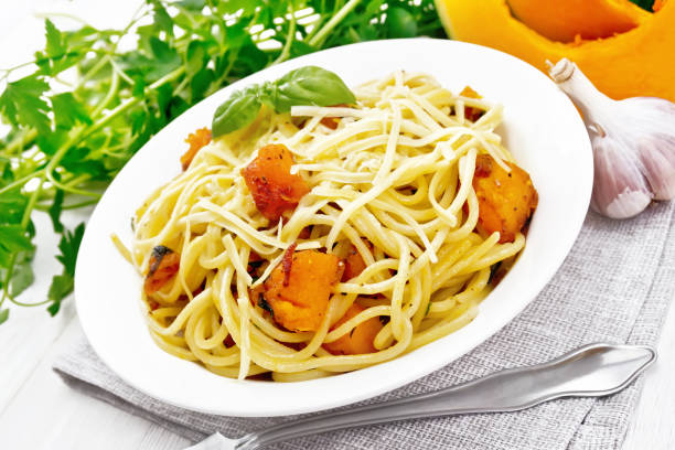 istock Spaghetti with pumpkin in plate on white board 1316019489