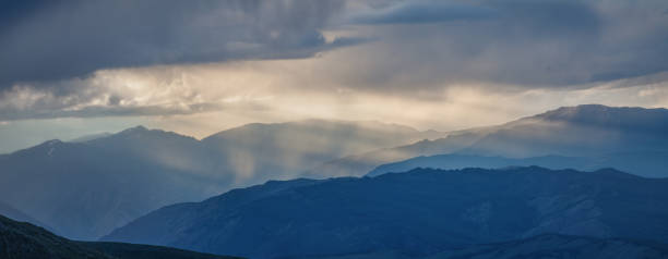 istock Rainy weather in the mountains, evening light. Panoramic view. 1316019510