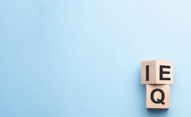 istock wood cube the expression IQ Intelligence Quotient to EQ Emotional Intelligence Quotient 1316020848