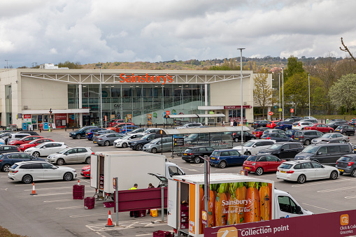 Sheffield, South Yorkshire, England - May 1 2021: A busy car park at a Sainsbury`s store in Sheffield, England