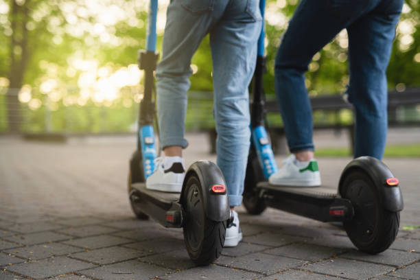 istock Mother and daughter riding electric scooters 1316021763