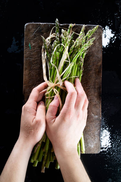 istock Collection and preparation of wild asparagus 1316024783