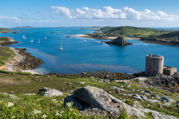 Tresco, Isles of Scilly, Cornwall, UK Tresco Channel showing Cromwell's Castle and Isle of Bryher tresco stock pictures, royalty-free photos & images