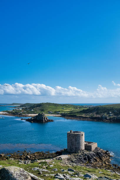 Cromwell's Castle, Tresco, Isles of Scilly, Cornwall, UK Looking towards Bryher tresco stock pictures, royalty-free photos & images