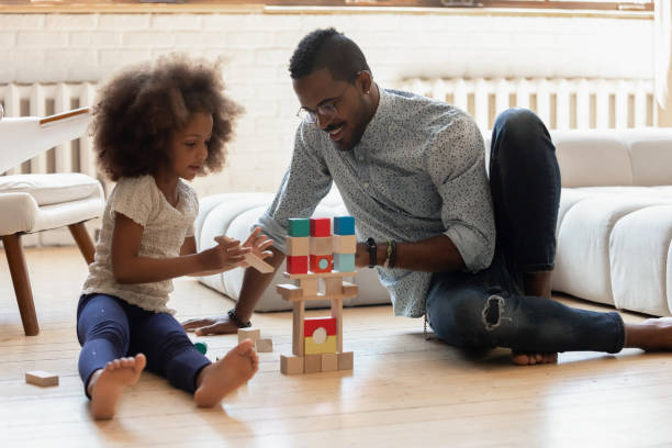 istock Happy dad helping daughter to build tower 1316025644