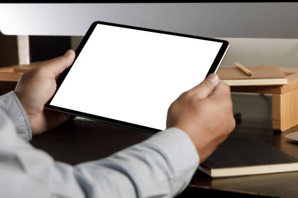 istock hands holding digital Mock up tablet touch screen device isolated screen and tablet pc with blank white screen 1316031298