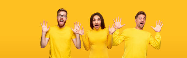 istock Shocked young people in yellow shirts 1316031621