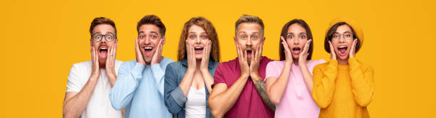 Contemporary people screaming in excitement Group of excited diverse men and women keeping hands on cheeks and shouting in amazement against yellow background women screaming surprise fear stock pictures, royalty-free photos & images