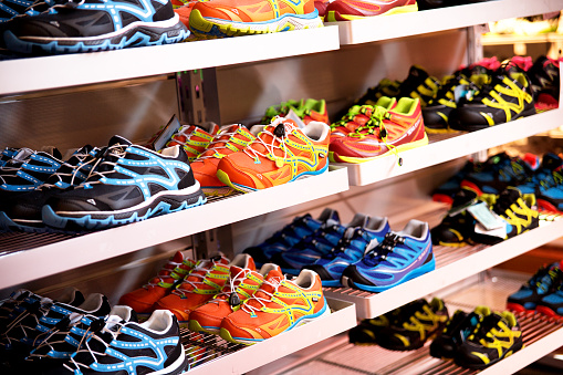 Sport shoes on shelf in shoe store