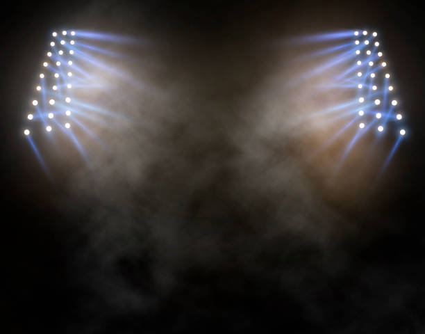 istock Bright stadium arena lights and smoke 1316033219