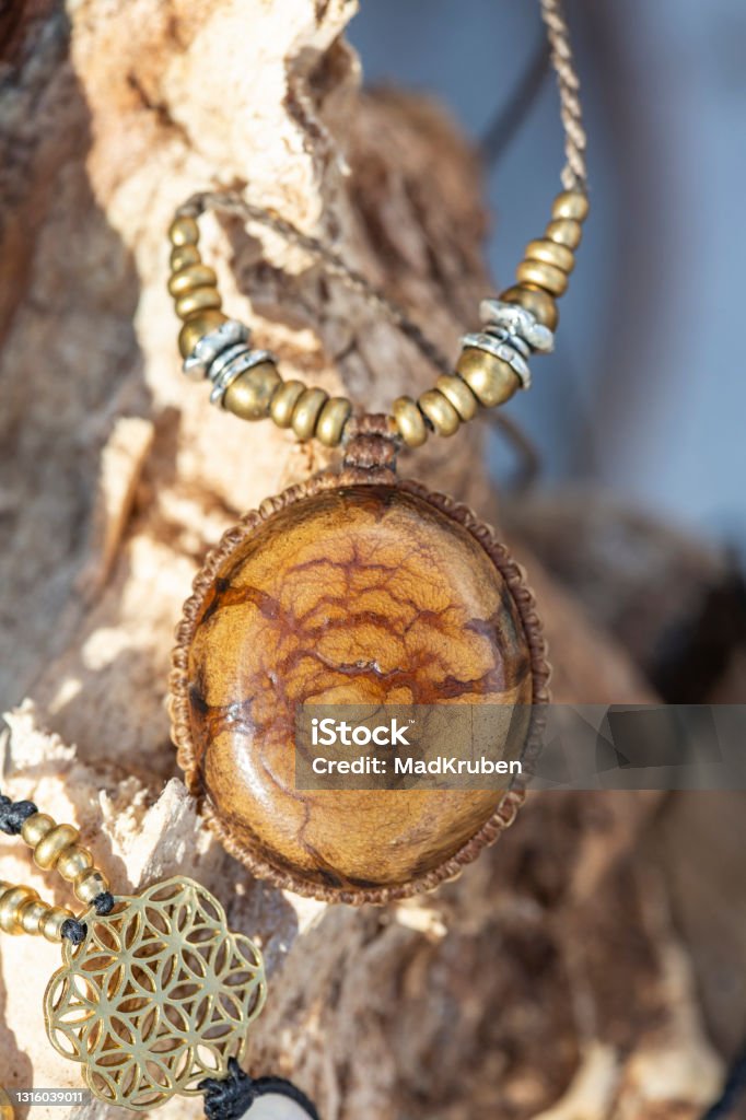 jewelry Ayahuasca jewelry necklace on natural woody background Banisteriopsis caapi Stock Photo