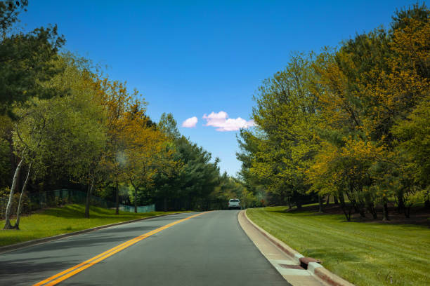istock Road in a sunny spring day, USA countryside 1316040427