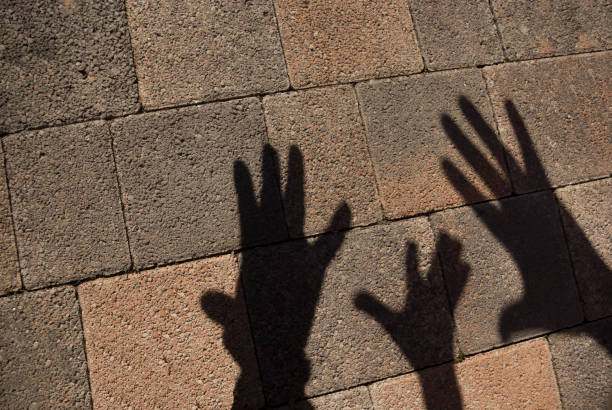 istock Hand shadow on the road on a sunny day top view 1316040626