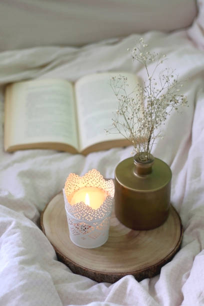 istock Flowers, Candle and Book 1316041019