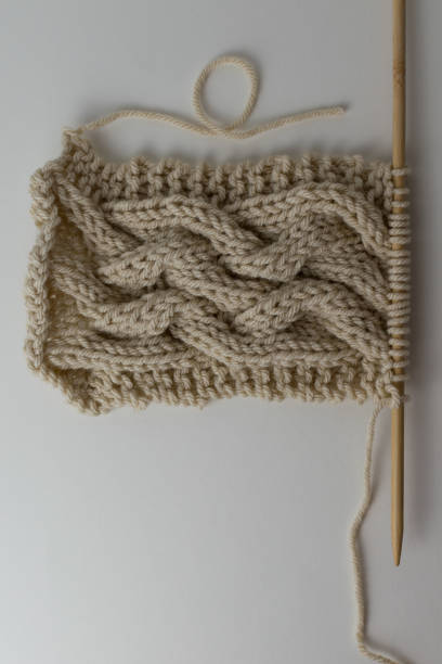istock Wooden knitting needles with cable stitch design 1316041674