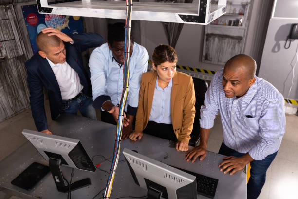 istock Four friends solving puzzles in quest room 1316041756