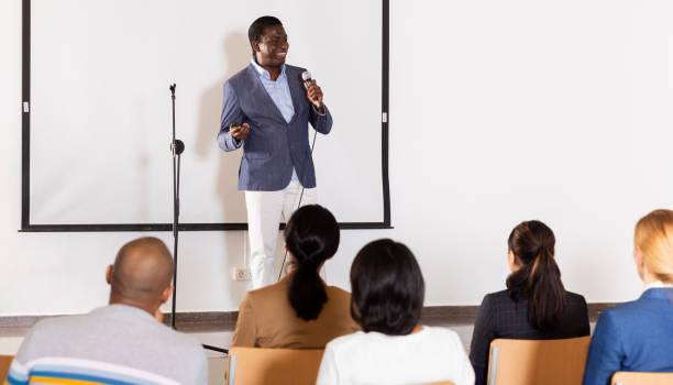 istock Successful aframerican business coach speaking at corporate training 1316041873