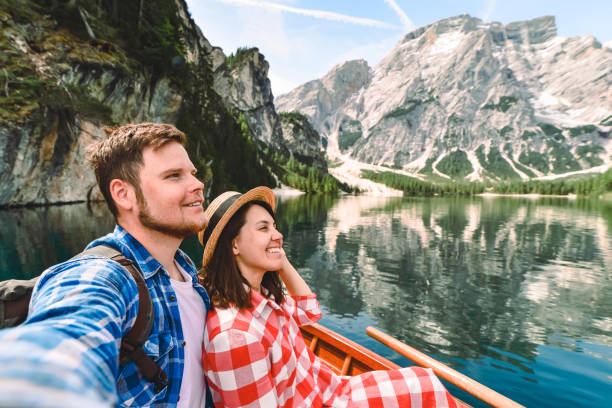 istock couple romantic date at boat on mountain lake 1316042549