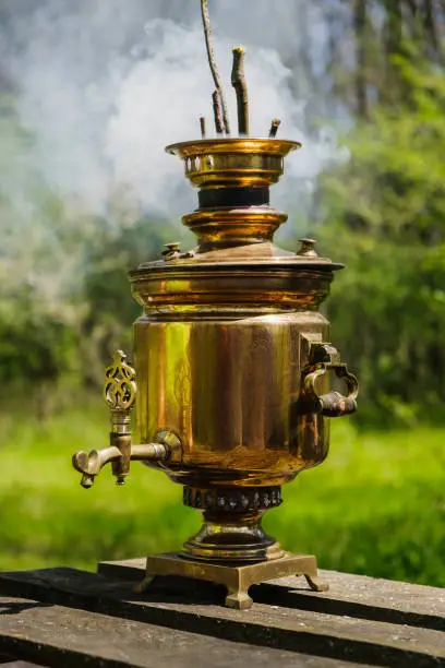 Antique wood-burning samovar with smoke