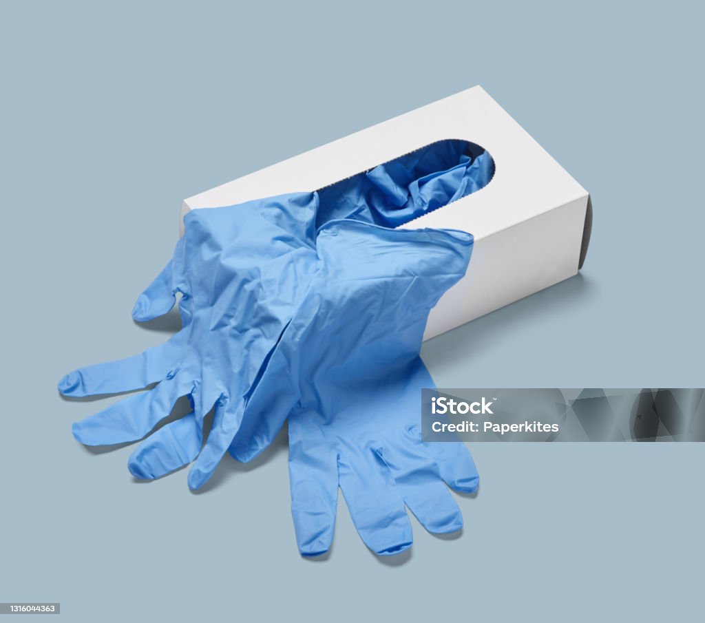 latex glove protective protection virus corona coronavirus epidemic disease medical health hygiene close up of a box of white latex protective gloves on white background Surgical Glove Stock Photo