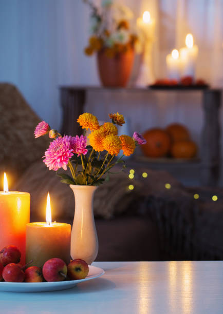 istock autumn decorations with burning candles at home 1316044489