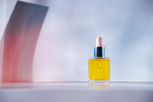 istock Yellow face oil on light pink and blue background 1316044890