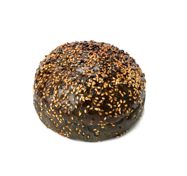 istock black baked bun with sesame seeds isolated on white background 1316046664