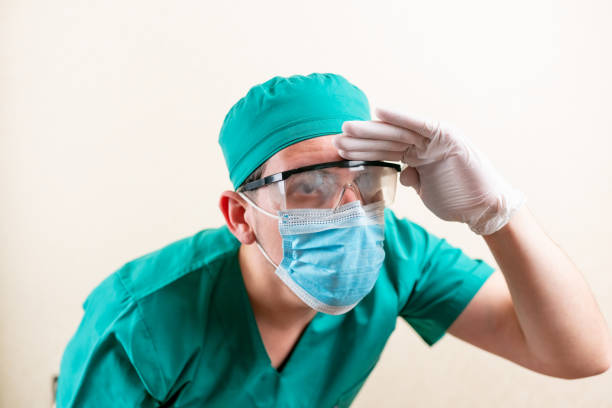 istock The doctor is wearing a mask and misted goggles. 1316051049