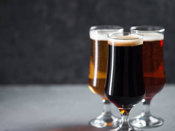istock Three glasses of beer . Different beer styles, pilsner, lager, stout 1316051541