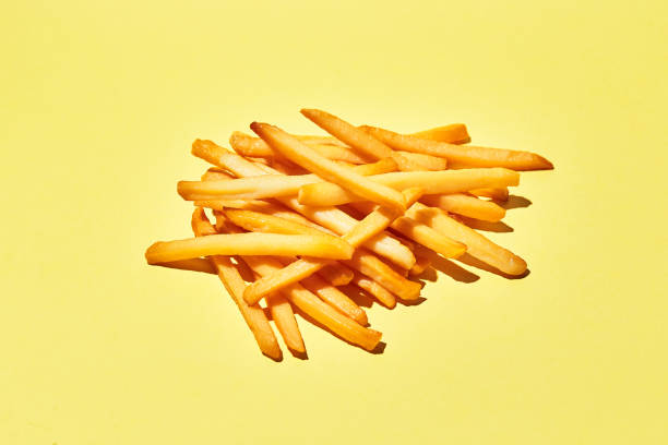 istock French fries on yellow background 1316051691