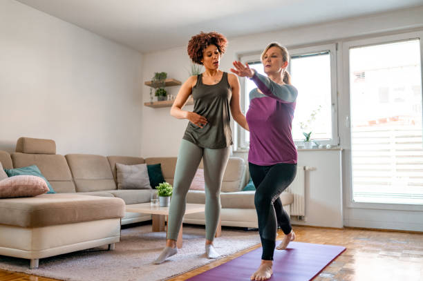 istock Two women exercizing in a living room 1316055681