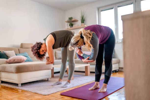 istock Two women exercising in a living room 1316055701