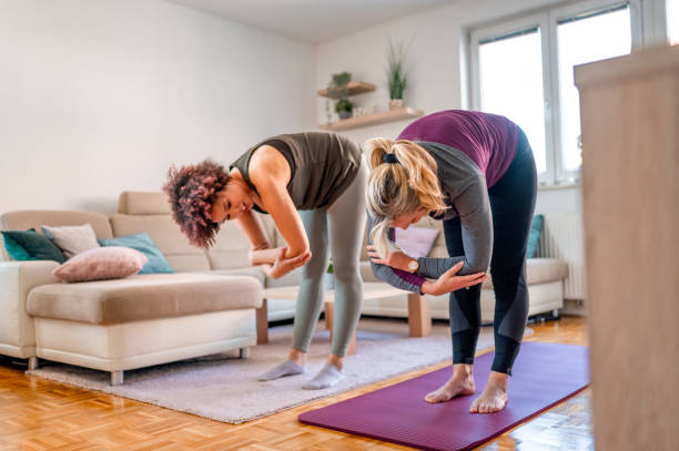 istock Two women exercising in a living room 1316055841