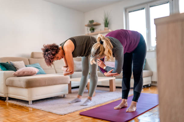 istock Two women exercising in a living room 1316056037