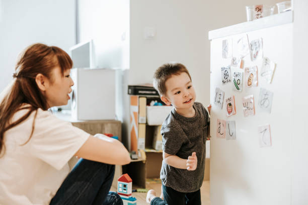 istock Young woman and child learning Japanese 1316056609