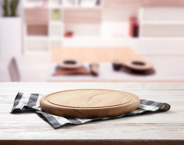 istock Empty vintage pizza board and napkin on planks. 1316057520