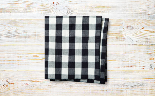 istock Napkin. Stack of dish towels on white desk. Top view 1316057540
